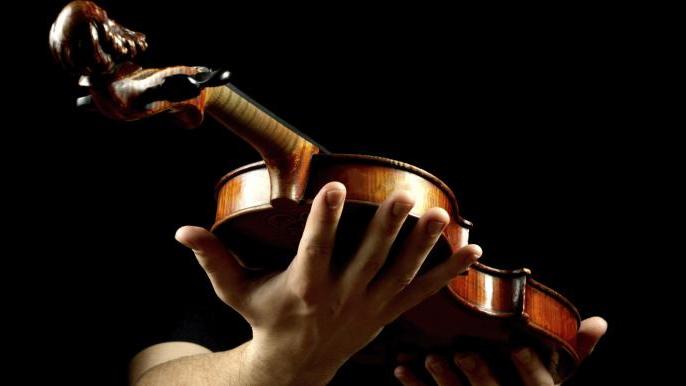 Student holds violin